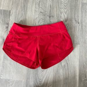 red Lululemon athletics shorts